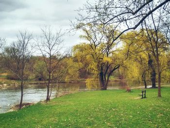 Scenic view of lake against cloudy sky