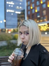 Young woman drinking water