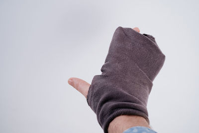 Close-up of hand against white background