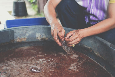 Midsection of man preparing food