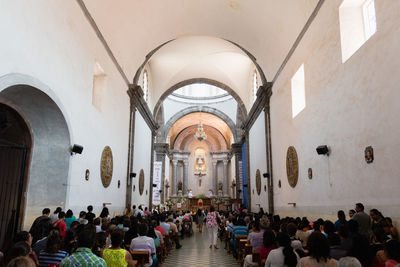 People sitting at pew in church