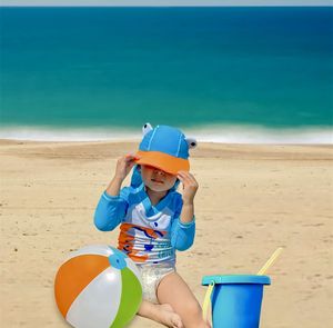 Rear view of woman standing at beach