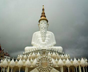 Low angle view of statue against sky