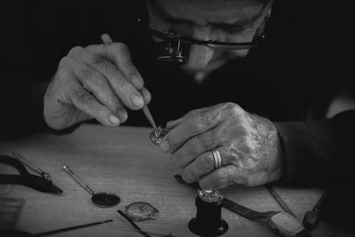 Man fixing pocket watch