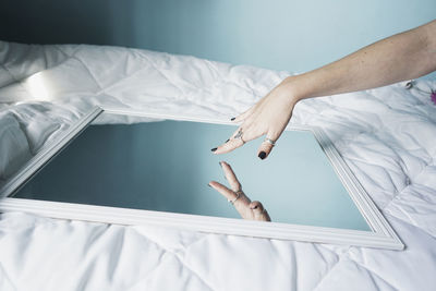 High angle view of person lying on bed