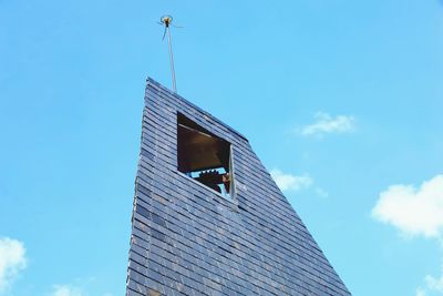 Low angle view of building against blue sky