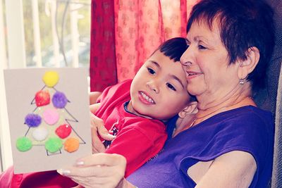 Close-up of mother with baby girl at home