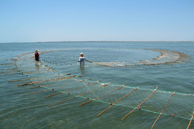 View of fishermen at sea