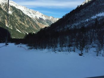 Scenic view of snowcapped mountains against sky