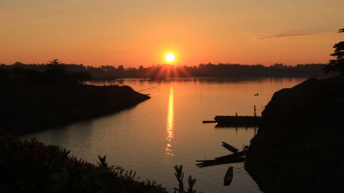 Scenic view of river during sunset