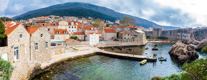 View of dubrovnik west pier and medieval fortifications of the city seen from fort lovrijenac