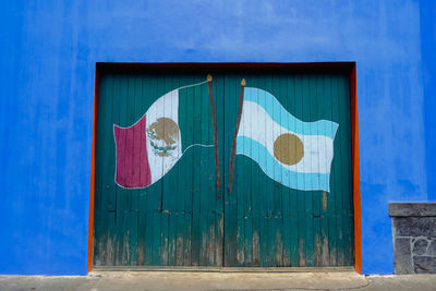 Graffiti on blue door