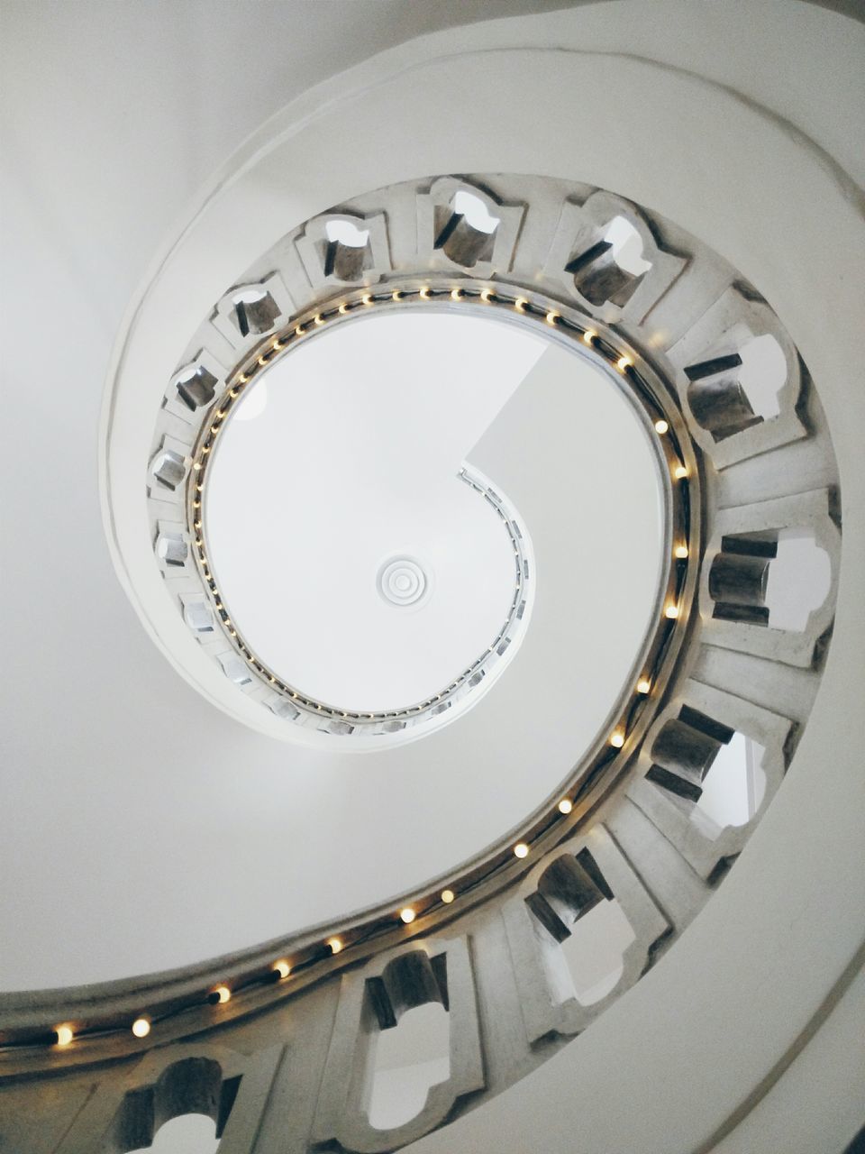 indoors, steps and staircases, staircase, spiral staircase, architecture, built structure, spiral, steps, railing, circle, directly below, low angle view, pattern, stairs, building, high angle view, geometric shape, design, directly above, ceiling
