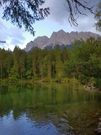 Scenic view of lake and mountains against sky