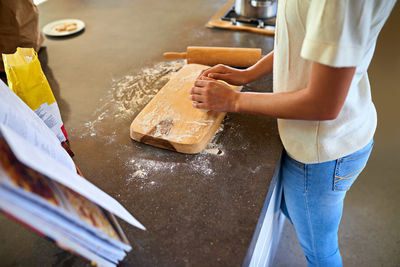 Midsection of man preparing food