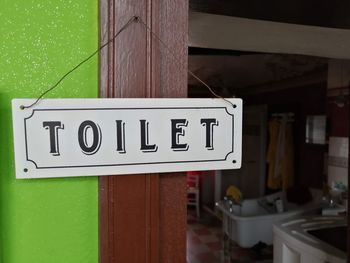 Close-up of information sign hanging