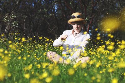 Woman with flowers on grass