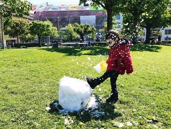 Full length of young woman in park