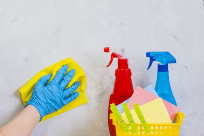 Close-up of hand holding multi colored umbrella