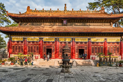 Statue in temple outside building