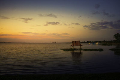 Scenic view of sea against sky at sunset