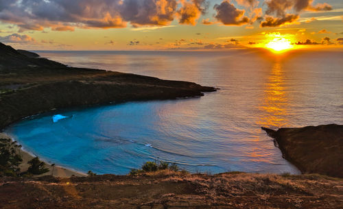 Scenic view of sea against sky during sunset