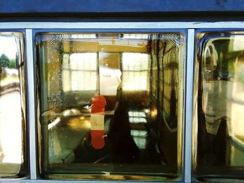 Reflection of train on glass window