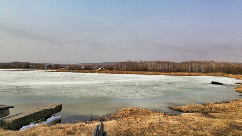 Scenic view of landscape against sky during winter