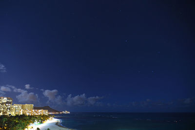Scenic view of sea against sky at night