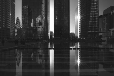 Modern skyscrapers with reflection in pond at la defense