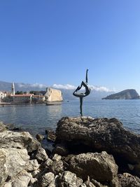 Scenic view of sea against clear blue sky