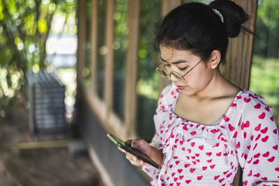 Close-up of young woman looking away