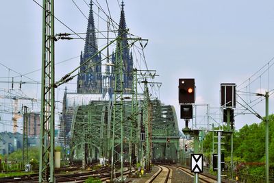 Electricity pylons against clear sky