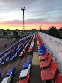 High angle view of empty seats during sunset