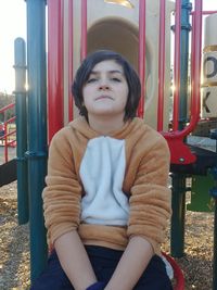 Portrait of girl sitting outdoors