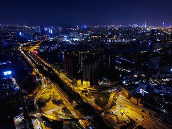 High angle view of illuminated cityscape at night