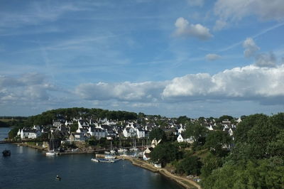 Panoramic view of townscape by sea against sky