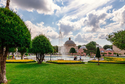 Gazebo in park with buildings in background