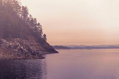 Scenic view of sea against sky at sunset