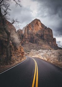 A road between mountains in zion national park, utah