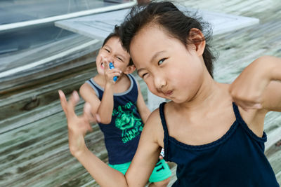 Portrait of girl with brother