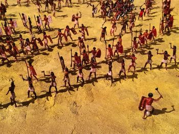 High angle view of people on sand