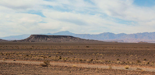 Scenic view of arid  desert landscape against sky