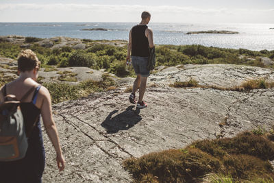 Friends walking at sea side