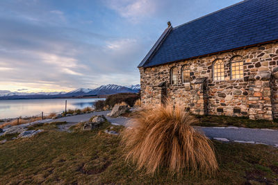 House by sea against sky