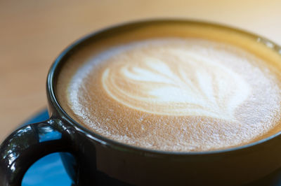 Close-up of cappuccino on table