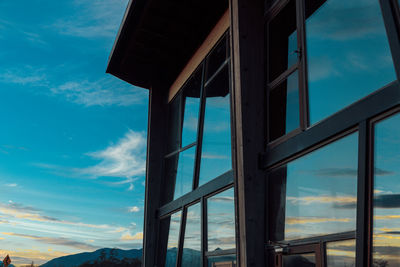 Low angle view of modern bridge against blue sky