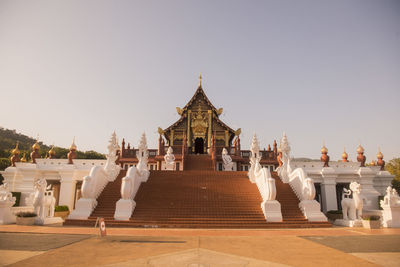 Exterior of temple building against clear sky