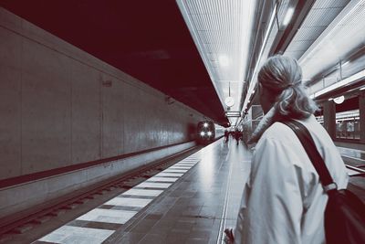 Commuter standing at subway station