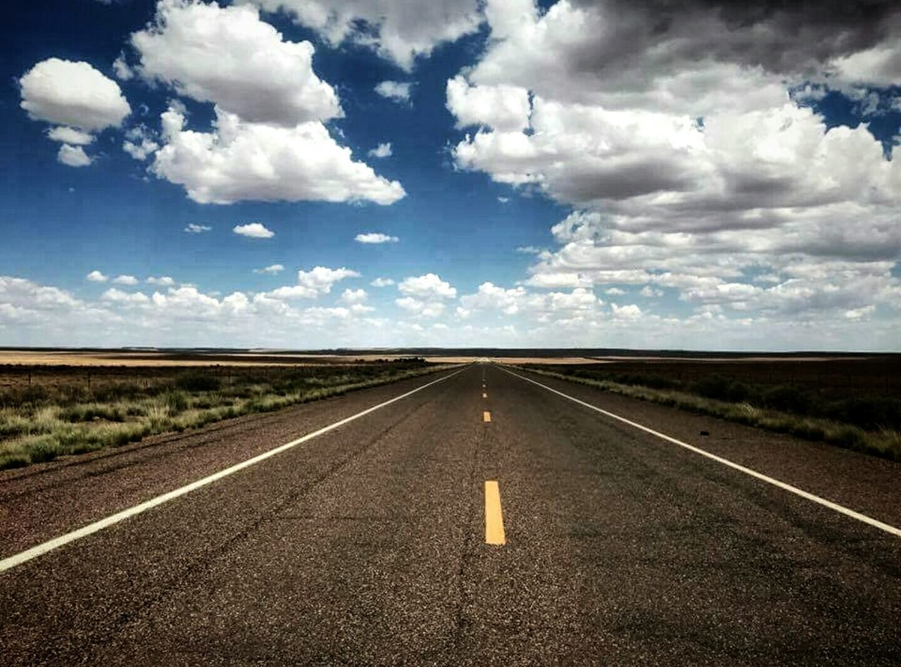 road, cloud - sky, road marking, the way forward, sky, landscape, diminishing perspective, dividing line, highway, transportation, horizon over land, travel, outdoors, no people, day, direction, journey, nature, scenics, horizon